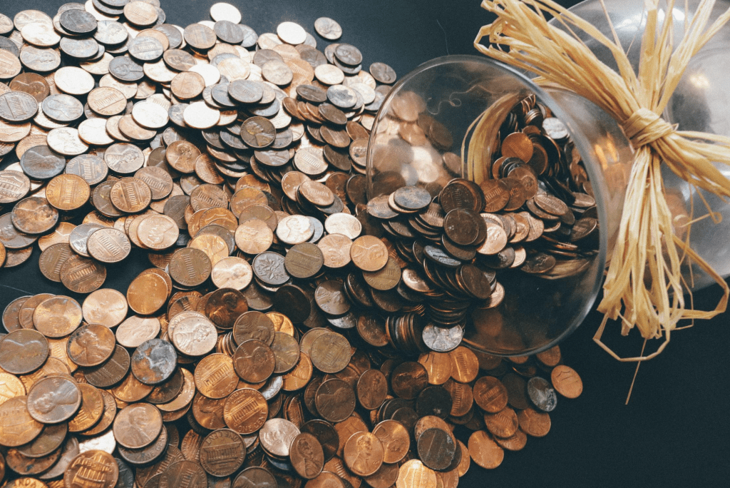 Photo of pennies falling out of a vase.